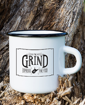 White metal mug with black rim, the mug says Grind WV